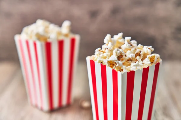 Two Packs Salty Popcorns Wooden Surface — Stock Photo, Image