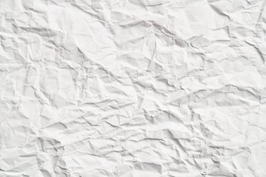 Kırışıklıkları olan beyaz buruşuk kağıt dokusu. Hasarlı ve yırtık çarşaf