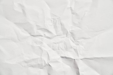 Kırışıklıkları olan beyaz buruşuk kağıt dokusu. Hasarlı ve yırtık çarşaf