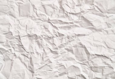 Kırışıklıkları olan beyaz buruşuk kağıt dokusu. Hasarlı ve yırtık çarşaf