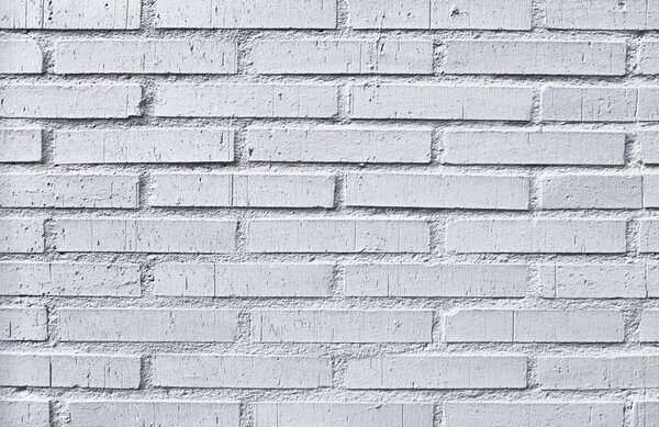 Brick wall texture with cracked tiles and cement. Classic brickwall surface background