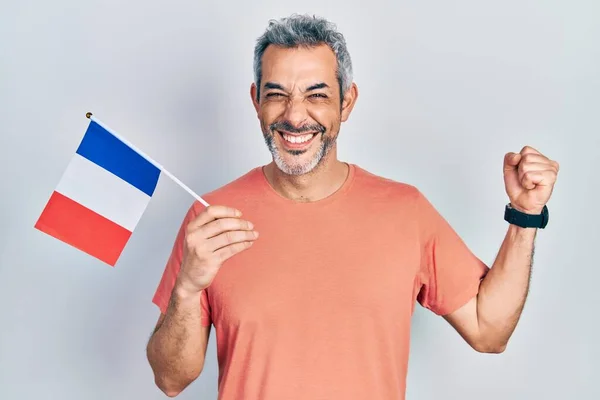 Handsome Middle Age Man Grey Hair Holding France Flag Screaming — Stok fotoğraf