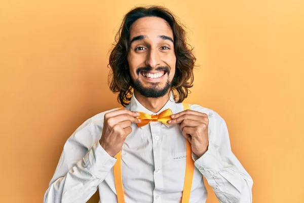 Young Hispanic Man Wearing Hipster Elegant Look Holding Bowtie Smiling — Stock Fotó