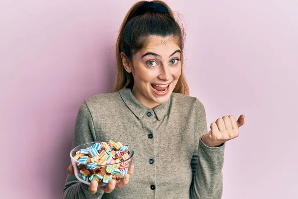 Young Caucasian Woman Holding Bowl Sugar Candy Screaming Proud Celebrating — Stock Fotó