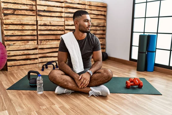 Young Indian Man Sitting Training Mat Gym Looking Side Relax — Stok fotoğraf