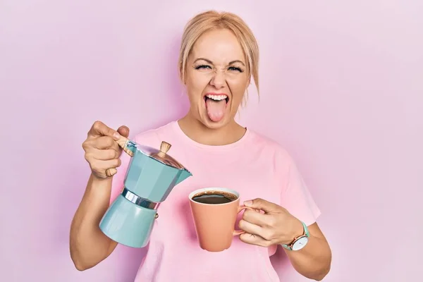 Young Blonde Woman Drinking Cup Fresh Coffee Sticking Tongue Out — Fotografia de Stock