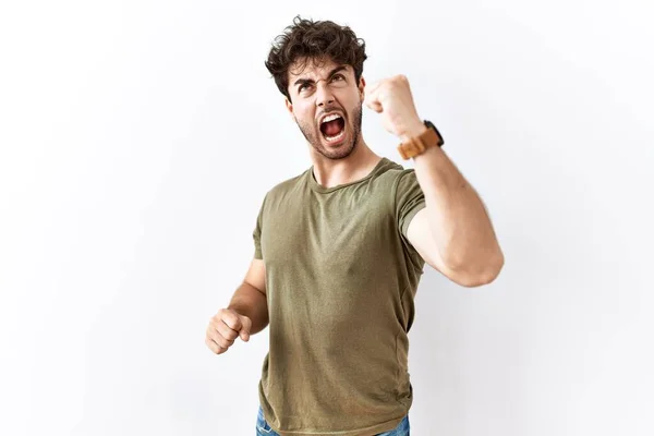 Hispanic Man Standing Isolated White Background Angry Mad Raising Fist — 스톡 사진