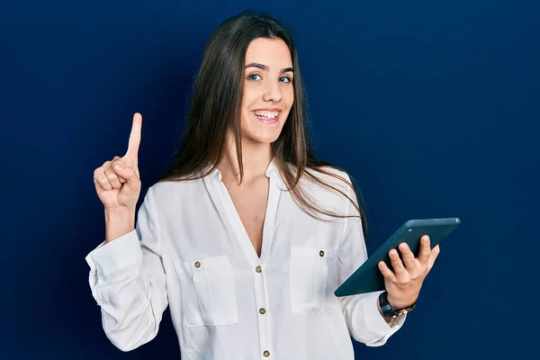 Young Brunette Teenager Using Touchpad Device Smiling Idea Question Pointing — Foto Stock