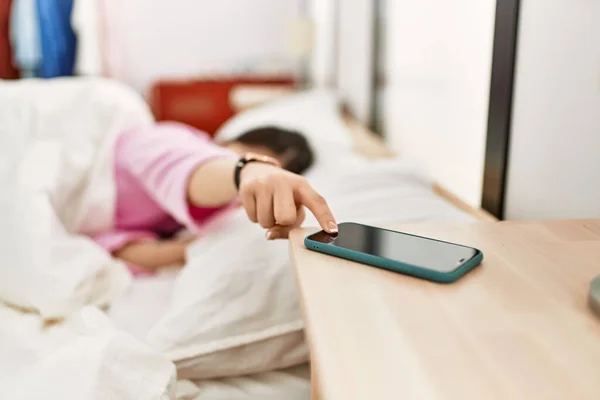 Girl Turning Smartphone Alarm Lying Bed Bedroom — Zdjęcie stockowe