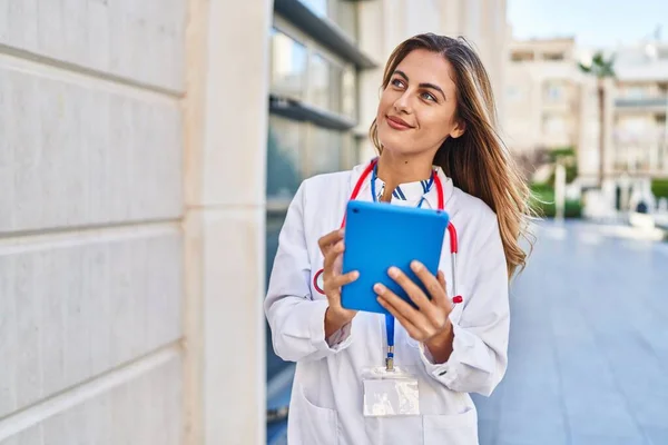 Young Blonde Woman Wearing Doctor Uniform Using Touchpad Hospital — Fotografia de Stock