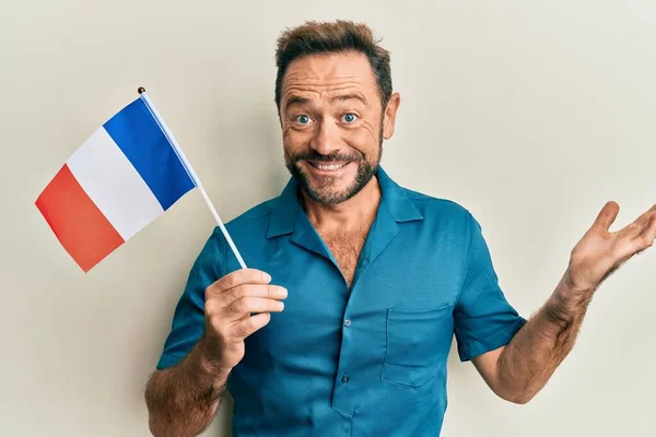 Middle Age Man Holding France Flag Celebrating Achievement Happy Smile — Stock fotografie