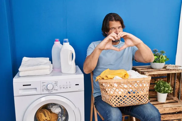 Handsome Middle Age Man Waiting Laundry Smiling Love Doing Heart —  Fotos de Stock