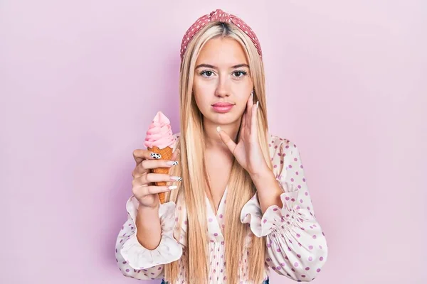 Young Blonde Girl Holding Ice Cream Relaxed Serious Expression Face — Fotografia de Stock