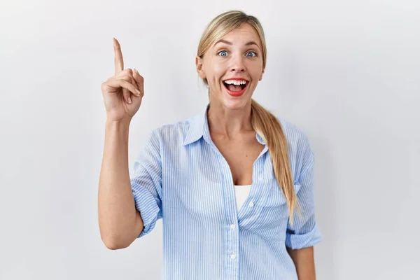 Beautiful Blonde Woman Standing White Background Pointing Finger Successful Idea — Foto Stock