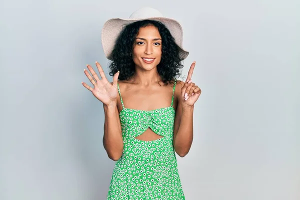 Young Latin Girl Wearing Summer Hat Showing Pointing Fingers Number — Stockfoto