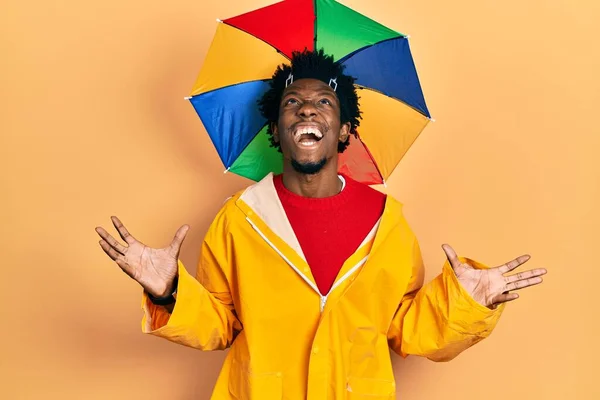 Young African American Man Wearing Yellow Raincoat Crazy Mad Shouting — Fotografia de Stock