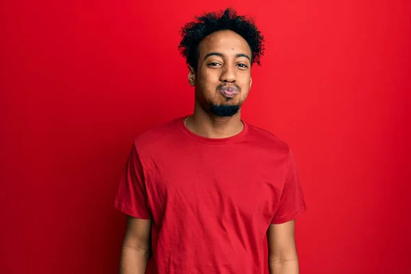 Young African American Man Beard Wearing Casual Red Shirt Puffing — 스톡 사진
