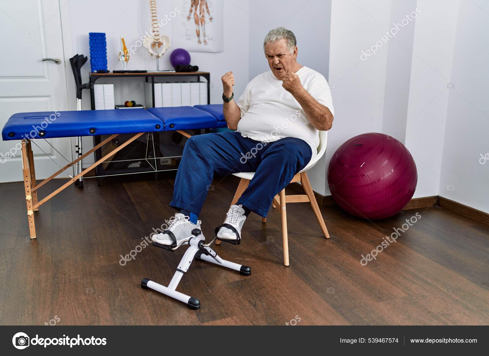 Senior Caucasian Man Physiotherapy Clinic Using Pedal Exerciser