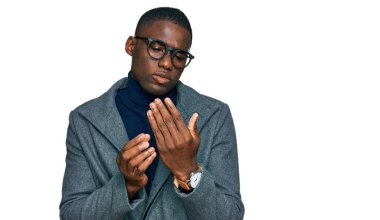 Young african american man wearing business clothes and glasses suffering pain on hands and fingers, arthritis inflammation 
