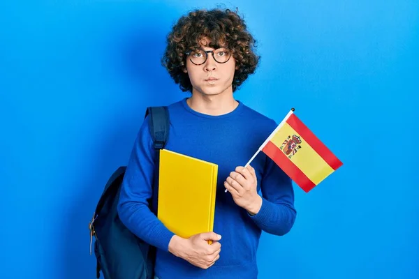 Handsome Young Man Exchange Student Holding Spanish Flag Puffing Cheeks — Zdjęcie stockowe