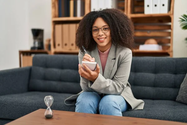 Young African American Woman Psychologist Writing Notebook Psychology Center — Zdjęcie stockowe