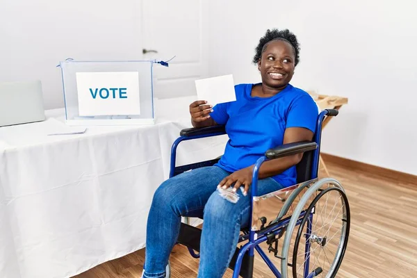Young African Woman Sitting Wheelchair Voting Putting Envelop Ballot Box —  Fotos de Stock