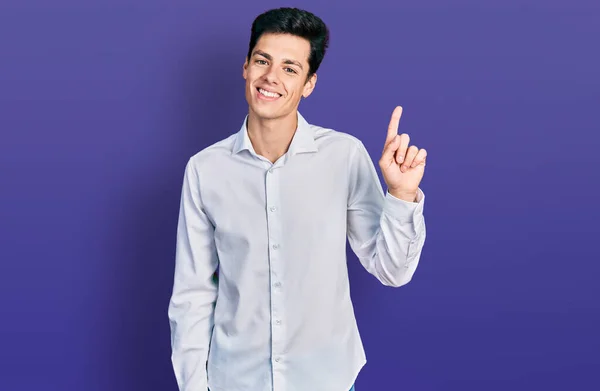Young Hispanic Business Man Wearing Business Clothes Showing Pointing Finger — Φωτογραφία Αρχείου