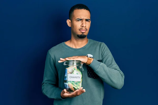 Young African American Man Holding Charity Jar South Africa Rand — Stockfoto
