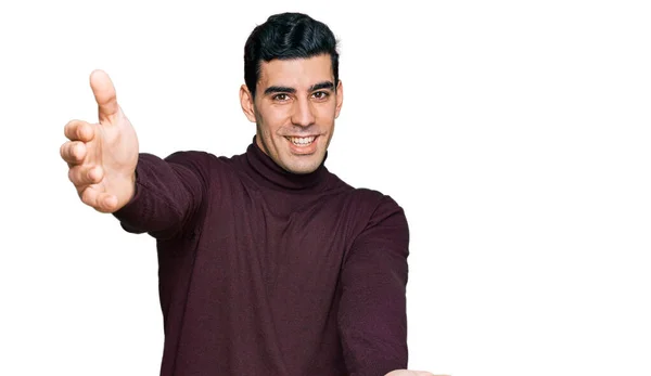 Handsome Hispanic Man Wearing Casual Turtleneck Sweater Looking Camera Smiling — Stock Photo, Image