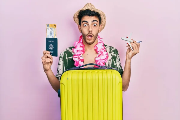 Young Hispanic Man Wearing Summer Style Hawaiian Lei Holding Passport — Stock fotografie