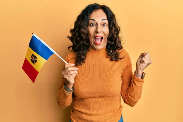 Middle Age Hispanic Woman Holding Moldova Flag Screaming Proud Celebrating — Stockfoto