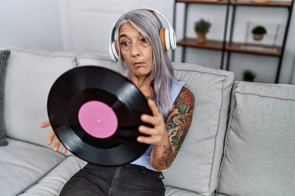 Middle Age Grey Haired Woman Listening Music Holding Vinyl Disc — Photo