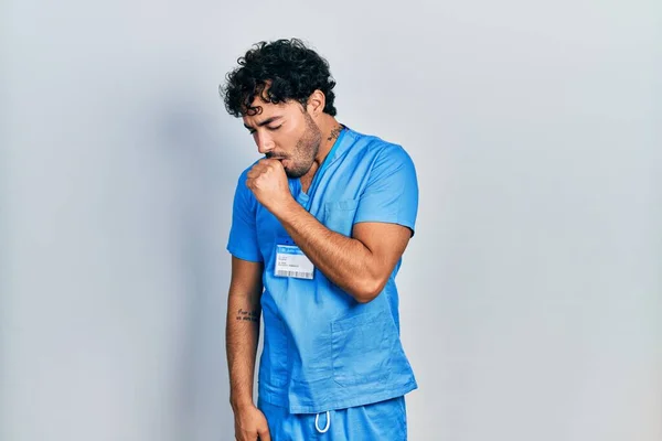 Young Hispanic Man Wearing Blue Male Nurse Uniform Feeling Unwell — Foto de Stock