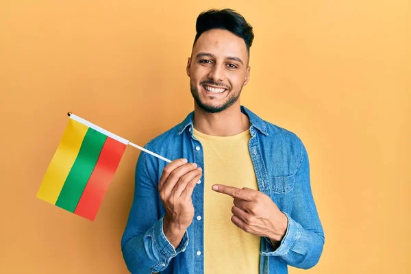 Young Arab Man Holding Lithuania Flag Smiling Happy Pointing Hand —  Fotos de Stock