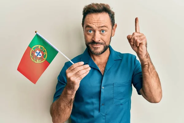 Middle Age Man Holding Portugal Flag Smiling Idea Question Pointing — Stok fotoğraf