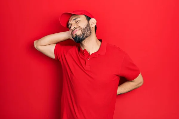 Hispanic Man Beard Wearing Delivery Uniform Cap Suffering Neck Ache — Zdjęcie stockowe