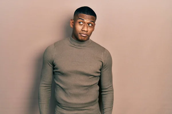 Young Black Man Wearing Casual Turtleneck Sweater Smiling Looking Side — Foto de Stock