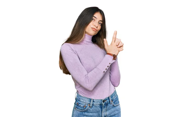 Young Beautiful Teen Girl Wearing Turtleneck Sweater Holding Symbolic Gun — стоковое фото