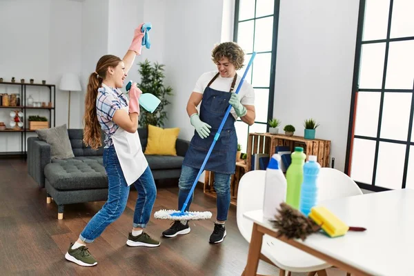 Young Caucasian Couple Cleaning House Standing Smile Face Singing Using — Stock Photo, Image