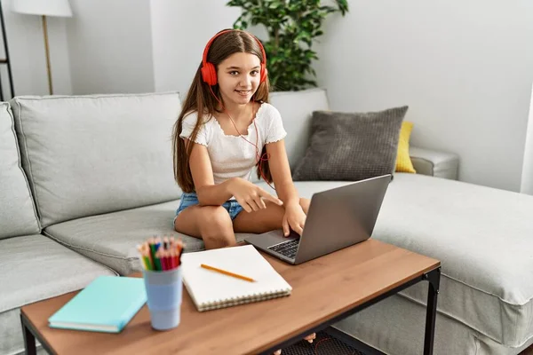 Young Brunette Teenager Doing Homework Laptop Home Smiling Happy Pointing — Stockfoto