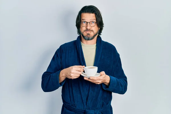 Middle Age Caucasian Man Wearing Robe Drinking Coffee Puffing Cheeks — ストック写真