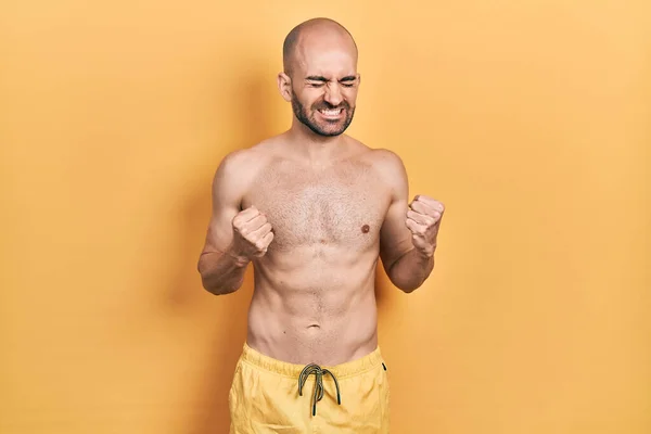 Young Bald Man Wearing Swimwear Excited Success Arms Raised Eyes — Zdjęcie stockowe