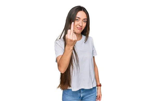 Young Hispanic Girl Wearing Casual White Shirt Showing Middle Finger — Stock fotografie