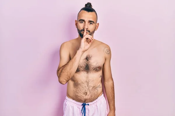 Young Hispanic Man Shirtless Wearing Swimsuit Asking Quiet Finger Lips — Stok fotoğraf