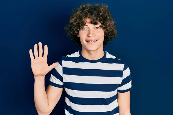 Handsome Young Man Wearing Casual Striped Shirt Showing Pointing Fingers — Foto de Stock