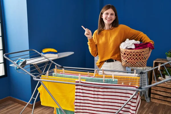 Young Brunette Woman Hanging Clothes Clothesline Smiling Happy Pointing Hand — Fotografia de Stock