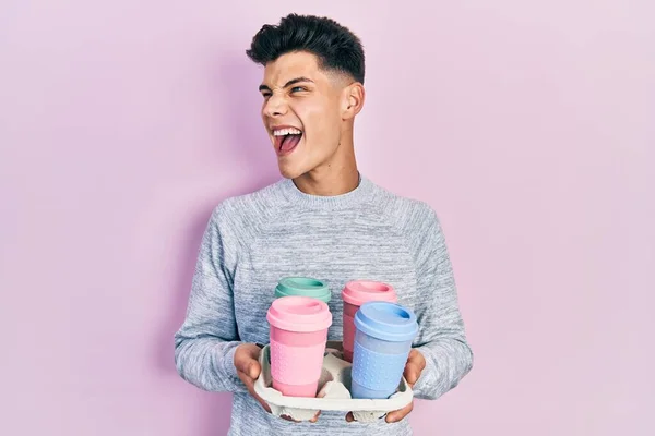 Young Hispanic Man Holding Tray Take Away Coffee Angry Mad — Fotografia de Stock