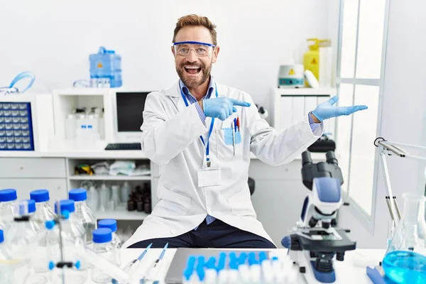Middle Age Man Working Scientist Laboratory Amazed Smiling Camera While — стоковое фото