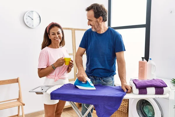 Middle Age Man Woman Couple Drinking Coffee Ironing Clothes Laundry — Stock Photo, Image