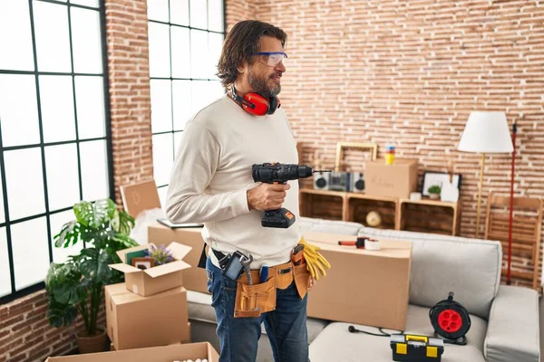 Handsome Middle Age Man Holding Screwdriver New Home Looking Side — Stock fotografie